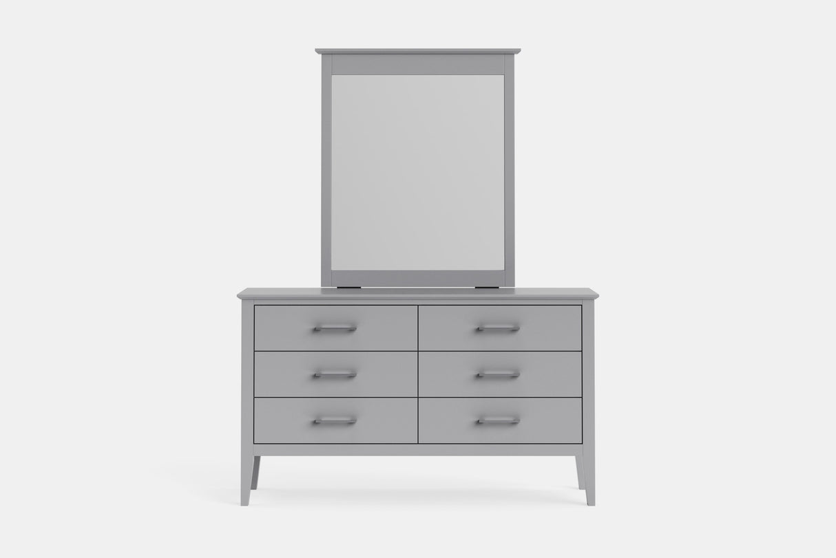 A light gray wooden dresser with six drawers and a matching rectangular mirror mounted above, shown against a plain light gray background.