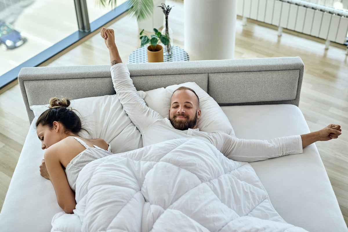 Image of a couple on a bed for the blog banner Best Bed to Buy in NZ [2026]: Top Mattress Guide