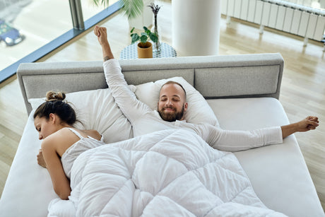 Image of a couple on a bed for the blog banner Best Bed to Buy in NZ [2026]: Top Mattress Guide