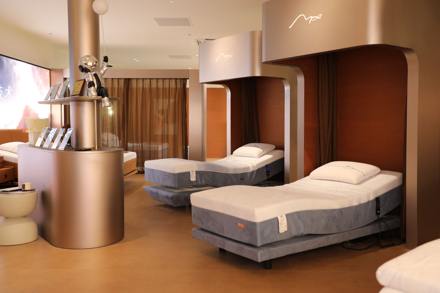 Modern bedroom with two beds and a metallic cylindrical object.
