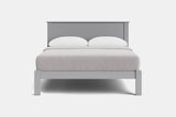 A modern light gray wooden bed frame with a low headboard and matching footboard, styled with white bedding and two white pillows against a plain white background.